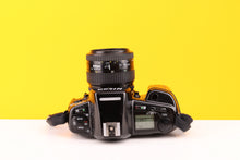 Load image into Gallery viewer, Nikon F90 35mm SLR Film Camera with Nikkor AF 35-70mm f3.3-4.5 Lens
