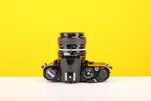 Load image into Gallery viewer, Nikon FM 35mm Film Camera with Nikon Nikkor 28mm f/2.8 Lens

