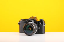 Load image into Gallery viewer, Nikon FM 35mm Film Camera with Nikon Nikkor 28mm f/2.8 Lens

