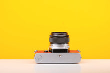 Load image into Gallery viewer, Olympus OM-1 35mm Film Camera with Olympus 50mm f/1.4 Prime Lens in Red
