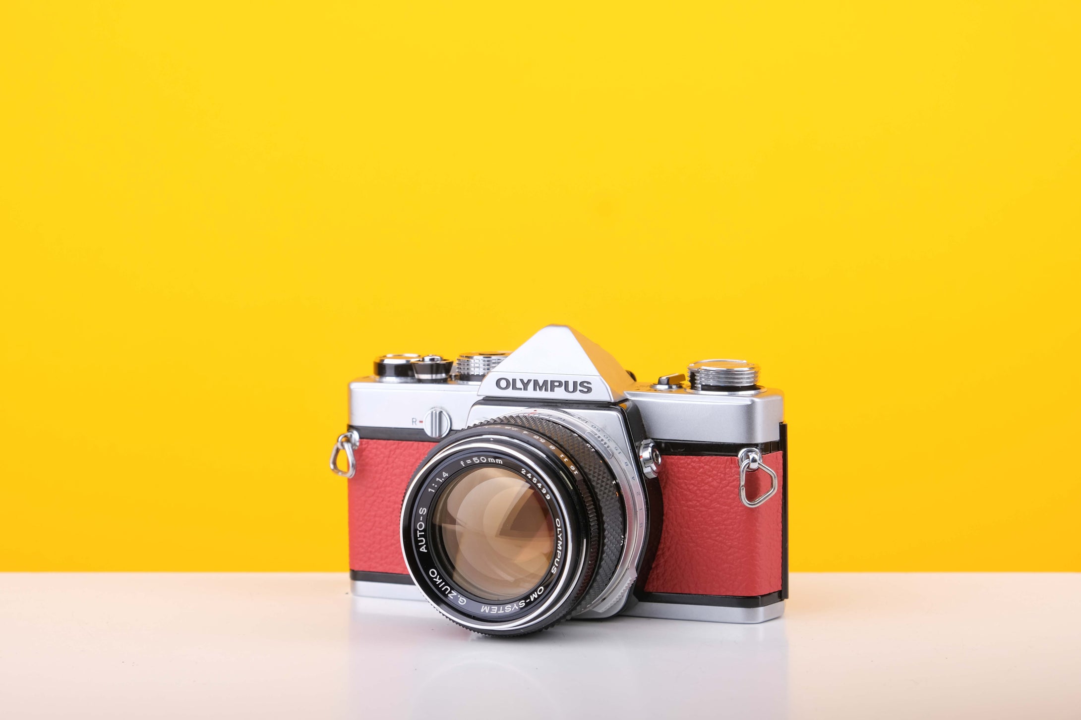 Olympus OM-1 35mm Film Camera with Olympus 50mm f/1.4 Prime Lens in Red