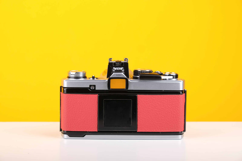 Olympus OM-2n MD 35mm SLR Film Camera with Zuiko Olympus OM-System Auto-S 50mm f1.8 Lens in Red