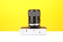 Load image into Gallery viewer, Olympus OM10 35mm SLR Film Camera with Miranda 28-70mm f3.8-4.8 MC Macro Lens
