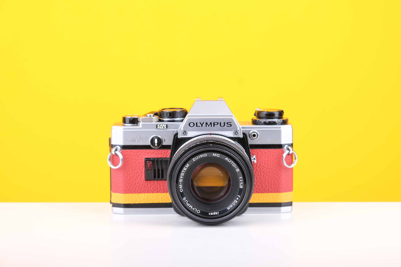 Olympus OM10 Slr Vintage 35mm Film Camera with Zuiko 50mm f1.8 Prime Lens with New Leather Red and Yellow Skin