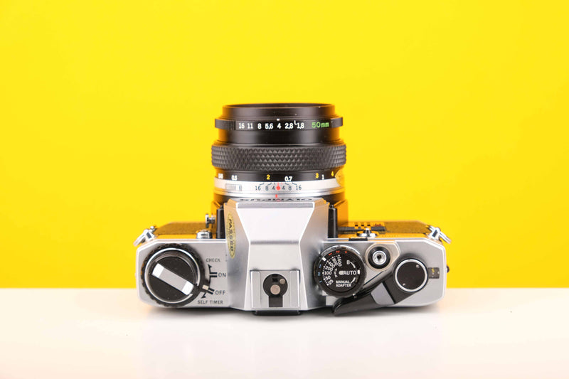 Olympus OM10 35mm Film Camera with Zukio Olympus OM-System MC Auto-S 50mm f1.8 Auto-Zoom Lens in Green