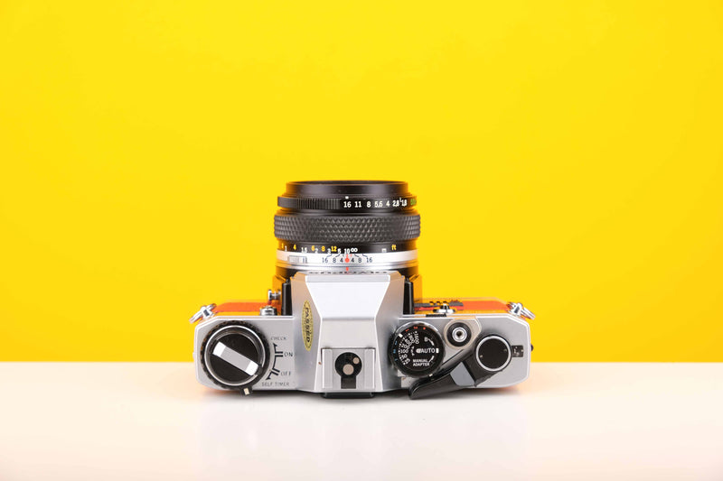 Olympus OM10 Slr Vintage 35mm Film Camera with Zuiko 50mm f1.8 Prime Lens with New Leather Red and Yellow Skin
