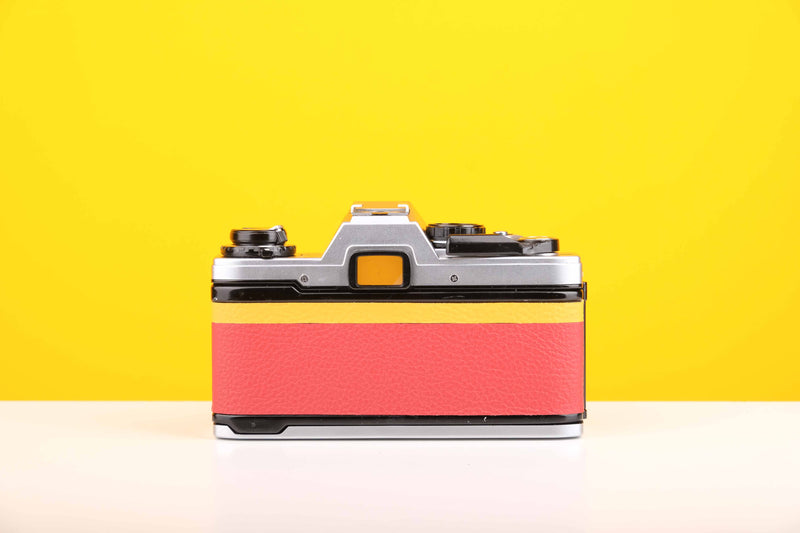 Olympus OM10 Slr Vintage 35mm Film Camera with Zuiko 50mm f1.8 Prime Lens with New Leather Red and Yellow Skin