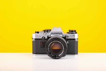 Load image into Gallery viewer, Olympus OM10 SLR 35mm Film Camera with Olympus Auto-S 50mm f/1.8 MC Lens
