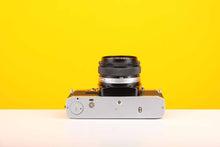 Load image into Gallery viewer, Olympus OM10 SLR 35mm Film Camera with Olympus Auto-S 50mm f/1.8 MC Lens
