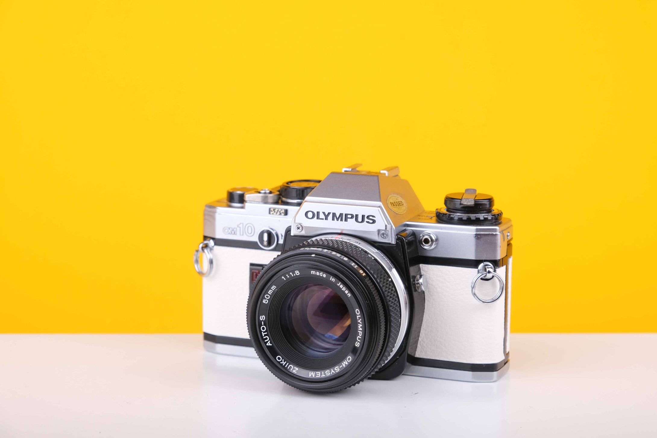 Olympus OM10 35mm Film Camera with Olympus OM-System Zukio Auto-S 50mm f1.8 Lens in New White Leather Skin
