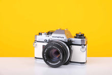 Load image into Gallery viewer, Olympus OM10 35mm Film Camera with Olympus OM-System Zukio Auto-S 50mm f1.8 Lens in New White Leather Skin
