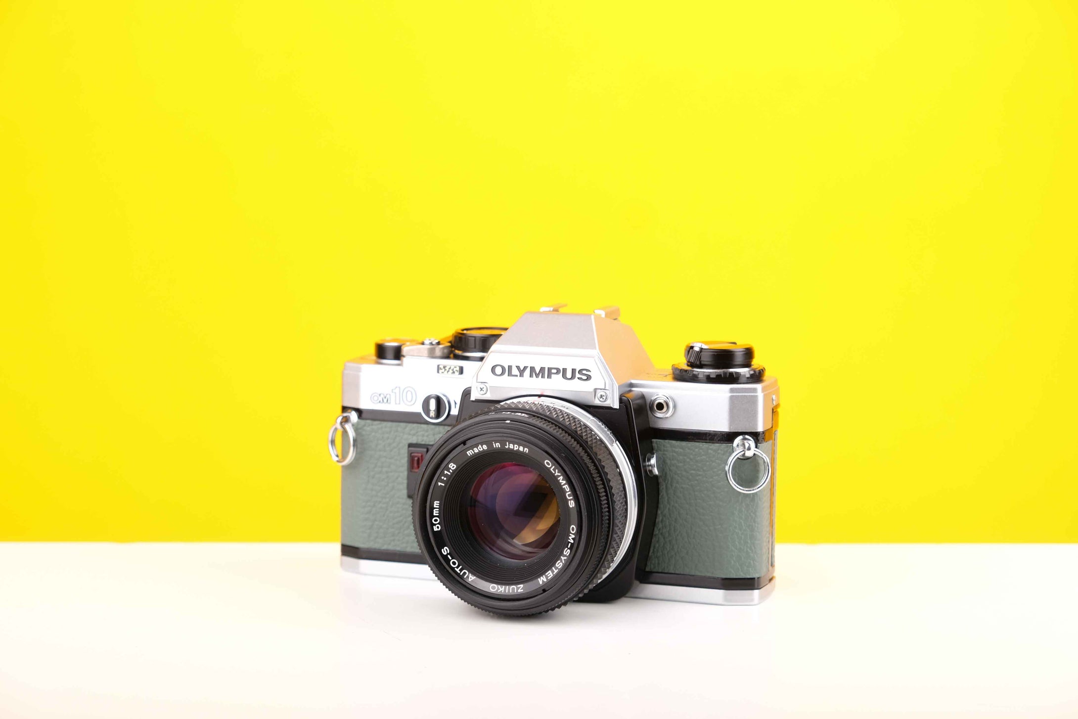 Olympus OM10 35mm Film Camera with Olympus Zukio Auto-S 50mm f1.8 Lens in Turquoise