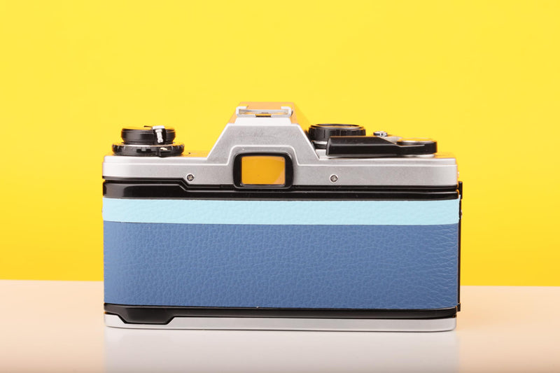 Olympus OM10 SLR Vintage 35mm Film Camera with Zuiko 50mm f/1.8 Prime Lens Reconditioned With New Blue Leather Skin