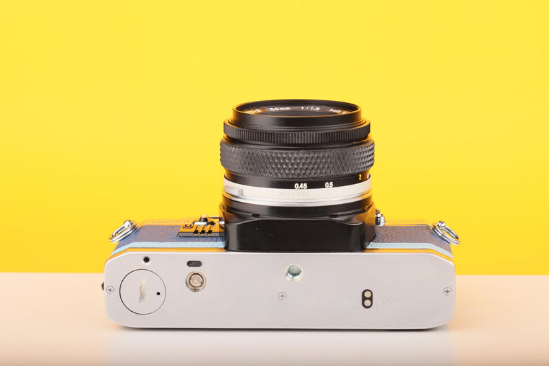 Olympus OM10 SLR Vintage 35mm Film Camera with Zuiko 50mm f/1.8 Prime Lens Reconditioned With New Blue Leather Skin