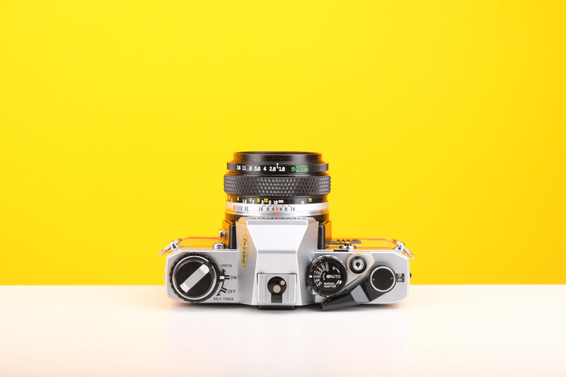 Olympus OM10 Slr Vintage 35mm Film Camera with Zuiko 50mm f1.8 Prime Lens and with New Leather Yellow and Red Skin