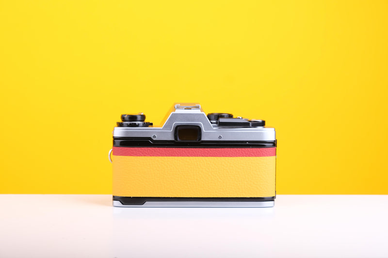 Olympus OM10 Slr Vintage 35mm Film Camera with Zuiko 50mm f1.8 Prime Lens and with New Leather Yellow and Red Skin