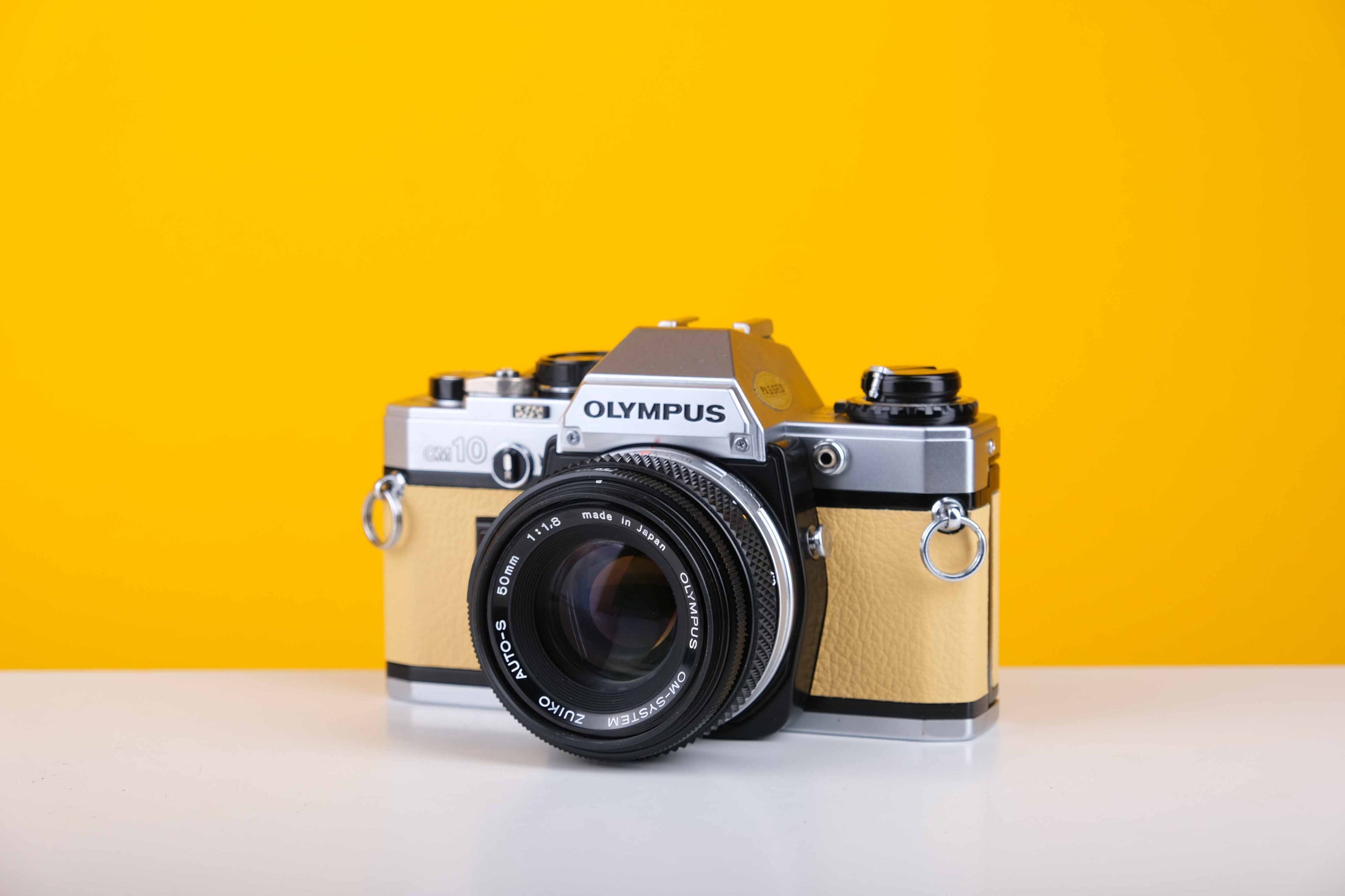 Olympus OM10 35mm SLR Film Camera with Olympus Zuiko OM-System Auto-S 50mm f1.8 Lens in Light Yellow