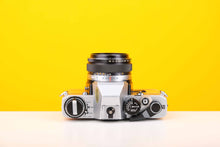 Load image into Gallery viewer, Olympus OM10 35mm SLR Film Camera with Manual Adapter and Olympus F.Zuiko Auto-S 50mm f1.8 Lens in Yellow
