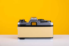 Load image into Gallery viewer, Olympus OM10 35mm SLR Film Camera with Olympus Zuiko OM-System Auto-S 50mm f1.8 Lens in Light Yellow
