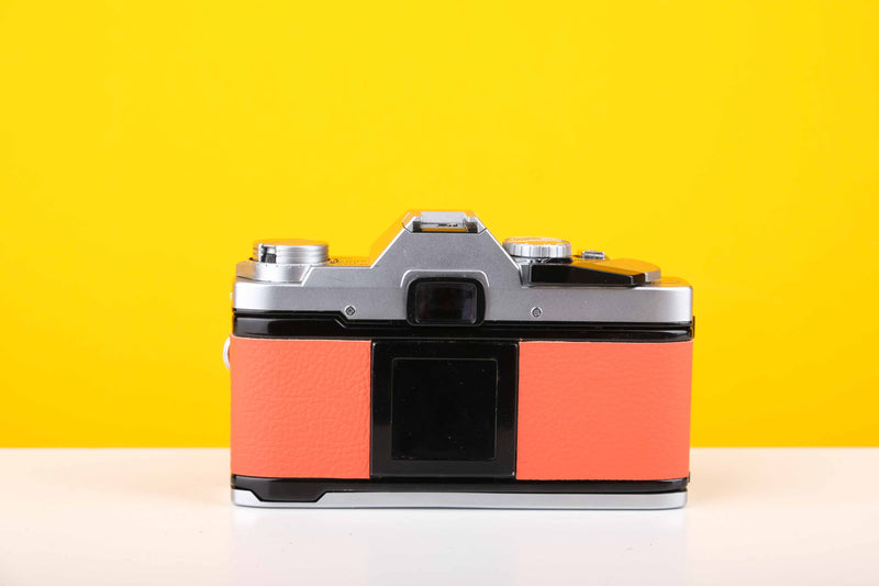 Olympus OM30 35mm Film Camera with Olympus Zuiko Auto-S 50mm f1.8 Lens in Orange
