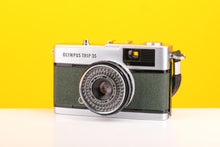 Load image into Gallery viewer, Vintage Olympus camera on a yellow background
