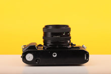 Load image into Gallery viewer, Canon A-1 35mm SLR Film Camera with Canon FD 50mm f1.8 Lens
