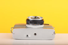 Load image into Gallery viewer, Olympus Trip 35 Vintage 35mm Film Camera with Zuiko 40mm f2.8 Lens and New Grey Leather Skin
