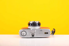 Load image into Gallery viewer, Olympus Trip 35 Vintage 35mm Film Camera with Zuiko 40mm f2.8 Lens and New Orange Leather Skin
