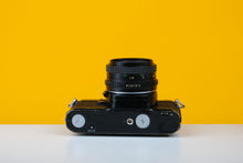 Load image into Gallery viewer, Pentax Mv1 35mm SLR Film Camera with Petri 50mm f/2.0 Lens

