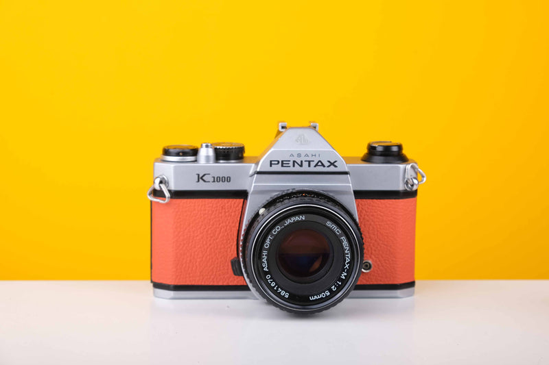 Pentax K1000 35mm Film Camera with SMC Pentax M 50mm f/2 Prime Lens in Orange