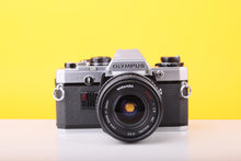 Load image into Gallery viewer, Olympus OM10 35mm SLR Film Camera with Miranda 24mm f/2.8 Wide Angle Lens
