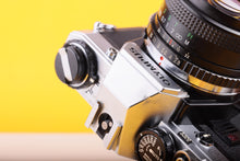 Load image into Gallery viewer, Olympus OM10 35mm SLR Film Camera with Miranda 24mm f/2.8 Wide Angle Lens
