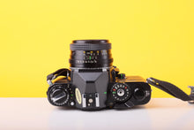 Load image into Gallery viewer, Chinon CE-4 35mm SLR Film Camera with Chinon 50mm f/1.9 Lens
