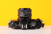 Load image into Gallery viewer, Minolta X-700 35mm SLR Film Camera with Minolta MD 50mm f1.7 Lens in Red
