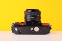 Load image into Gallery viewer, Minolta X-700 35mm SLR Film Camera with Minolta MD 50mm f1.7 Lens in Red
