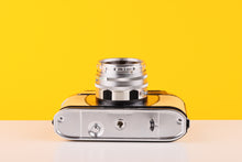 Load image into Gallery viewer, Halina Paulette Electric 35mm Viewfinder Film Camera with Halinar 45mm f2.8 F.C. Lens in Light Yellow
