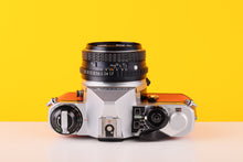 Load image into Gallery viewer, Pentax ME Super Vintage 35mm Film Camera with SMC Pentax-M 50mm f/1.7 Lens in Orange
