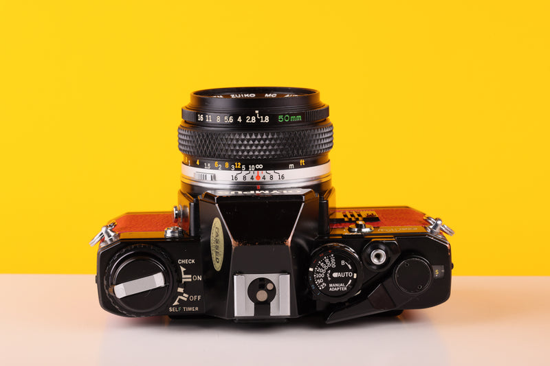 Olympus OM10 Black Quarz 35mm SLR Film Camera with Zuiko 50mm f/1.8 Lens