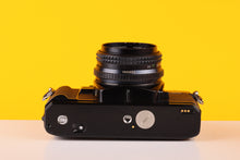 Load image into Gallery viewer, Minolta X-700 35mm Film SLR Camera with Minolta MD Rokkor 45mm f/2 Lens
