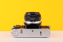 Load image into Gallery viewer, Olympus OM20 35mm SLR Film Camera with Zuiko 50mm f1.8 Lens
