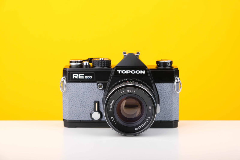 Topcon RE 200 35mm SLR Film Camera with RE Topcor 55mm f1.7 Lens in Grey