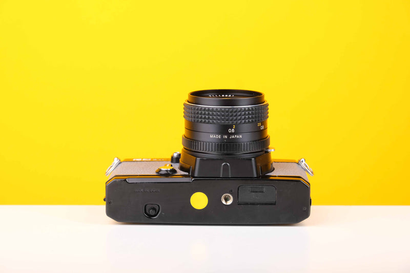 Topcon RE 200 35mm SLR Film Camera with RE Topcor 55mm f1.7 Lens in Grey