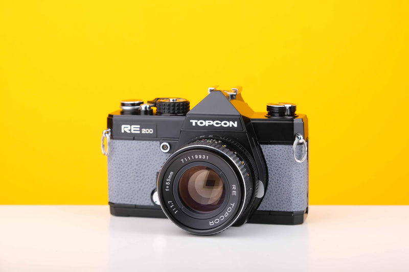 Topcon RE 200 35mm SLR Film Camera with RE Topcor 55mm f1.7 Lens in Grey