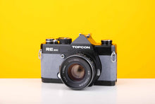 Load image into Gallery viewer, Topcon RE 200 35mm SLR Film Camera with RE Topcor 55mm f1.7 Lens in Grey
