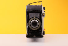 Load image into Gallery viewer, Kodak Junior II London Folding Camera with 105mm f/6.3 Anaston Lens
