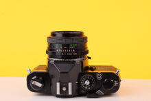 Load image into Gallery viewer, Chinon CM-4S 35mm SLR Film Camera + Vivitar 28mm f/2.8 Lens

