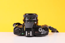 Load image into Gallery viewer, Minolta X-300 35mm SLR Film Camera with Soligor 28mm f/2.8 Lens
