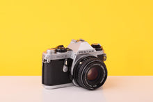 Load image into Gallery viewer, Pentax ME F 35mm SLR Film Camera + SMC Pentax-M 50mm f/1.7 Lens
