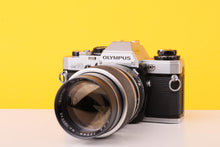 Load image into Gallery viewer, Olympus OM10 35mm Film SLR Camera + Sun 135mm f/2.8 Tele YS-13 Lens
