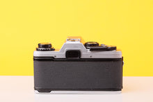 Load image into Gallery viewer, Olympus OM10 35mm Film SLR Camera + SunAction MC Auto Zoom 35–70mm f/3.5–4.5 Macro Lens

